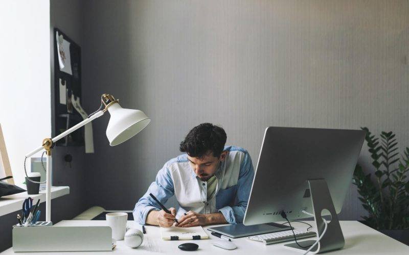 young-graphic-designer-working-in-office-1-re2qhxb2bvffrc6w07ixt1b16i3i3txdzfei52tj0o